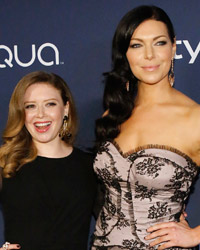 Actresses Natasha Lyonne (L) and Laura Prepon pose at the 15th annual Warner Bros. and InStyle after party, after the 71st annual Golden Globe Awards in Beverly Hills, California