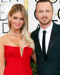 Actor Aaron Paul and wife Lauren Parsekian arrive at the 71st annual Golden Globe Awards in Beverly Hills, California