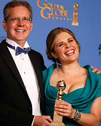 Directors Chris Buck and Jennifer Lee pose backstage after they won for Best Animated Feature Film for 'Frozen' at the 71st annual Golden Globe Awards in Beverly Hills, California