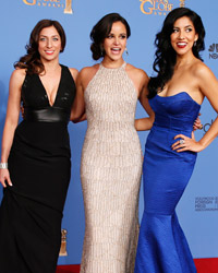 Actress Chelsea Peretti, Melissa Fumero and Stephanie Beatriz (L-R) from Brooklyn Nine-Nine pose backstage at the 71st annual Golden Globe Awards in Beverly Hills, California