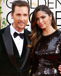 Actor Matthew McConaughey from the film 'The Dallas Buyers Club' arrives with Camila Alves at the 71st annual Golden Globe Awards in Beverly Hills, California