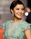 Taiwanese Actress Amber Kuo poses for photographers on the red carpet at the 49th Golden Horse Film Awards in Ilan county