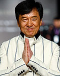 Hong Kong Kung Fu Director and Actor Jackie Chan poses for photographers on the red carpet at the 49th Golden Horse Film Awards in Ilan county