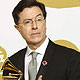 Stephen Colbert poses with his award for best comedy album at the 52nd annual Grammy Awards in Los Angeles