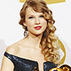 Taylor Swift holds her four Grammy awards at the 52nd annual Grammy Awards in Los Angeles