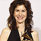 Sharon Isbin poses with her award for best instrumental soloist performance at the annual Grammy Awards in Los Angeles