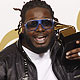 T-Pain holds his award for best R&B performance by a duo or group at the annual Grammy Awards in Los Angeles