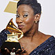 Le'Andria Johnson holds her award for at the 54th annual Grammy Awards in Los Angeles