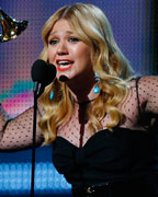 Kelly Clarkson accepts the Grammy for best pop vocal album at the 55th annual Grammy Awards in Los Angeles, California