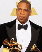 Jay-Z poses with the awards he won for Best Rap Performance, Best Rap/Sung Collaboration and Best Rap Song backstage at the 55th annual Grammy Awards in Los Angeles