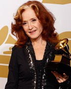 Singer Bonnie Raitt pose with her Grammy award for Best Americana Album for 'Slipstream' backstage at the 55th annual Grammy Awards in Los Angeles, California