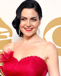 Jennifer Gasoi poses with her award for Best Childrens Album for 'Throw a Penny in the Wishing Well' at the 56th annual Grammy Awards in Los Angeles, California