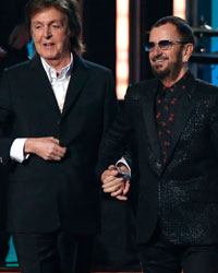 Paul McCartney and Ringo Starr prepare to take a bow after performing together at the 56th annual Grammy Awards in Los Angeles, California