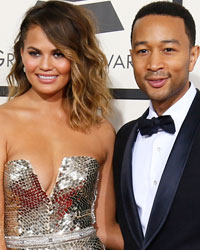 John Legend and his wife Chrissy Teigen arrive at the 56th annual Grammy Awards in Los Angeles, California