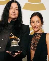 Jonas Akerlund and Violaine Etienne pose backstage with their award for best music film for Paul McCartney's 'Live Kisses' at the 56th annual Grammy Awards in Los Angeles, California