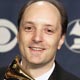 David Frost holds his award backstage at the 47th annual Grammy Awards in Los Angeles.