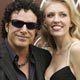 Neal Schon, member of the band 'Journey' and wife Amber arrive at the 47th annual Grammy Awards.