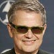 Charlie Haden poses backstage with his award at the 47th annual Grammy Awards.