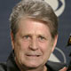 Former Beach Boy Brian Wilson holds his award backstage at the 47th annual Grammy Awards at the Staples Center in Los Angeles.