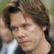 Actor and musician Kevin Bacon arrives at the 47th annual Grammy Awards at the Staples Center in Los Angeles.