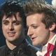 Members of the band Green Day accept the award for best rock album during the 47th annual Grammy Awards in Los Angeles.