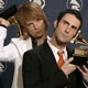 Maroon5 members Mickey Madden (L) and Adam Levine (R) hold their awards for best new artist, backstage at the 47th annual Grammy Awards.