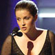 Lisa Marie Presley presents the award for the Best Rock Performance by a Duo or Group with Vocals to U2 during the 47th annual Grammy Awards.