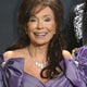 Loretta Lynn backstage with her two awards at the 47th annual Grammy Awards at the Staples Center in Los Angeles.