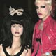 Singer and actress Kelly Osbourne (L) and an unidentified friend pose at the Clive Davis pre-Grammy party in Beverly Hills.