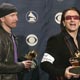  U2's The Edge (L) and Bono (R) hold their awards backstage at the 47th annual Grammy Awards at the Staples Center in Los Angeles.