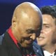 Producer Phil Ramone (R) presents the award for album of the year to Joe Adams, manager for the late Ray Charles, during the 47th annual Grammy Awards in Los Angeles.