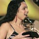 Musician Norah Jones (L) accepts the award for best pop collaboration with vocals from Cyndi Lauper during the preshow telecast at the 47th annual Grammy Awards in Los Angeles.