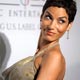 Actress Nicole Murphy poses for photographers at the Clive Davis Pre-Grammy Party in Beverly Hills, California