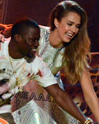 Actors Jessica Alba and Kevin Hart present an award at the 2013 Kids Choice Awards in Los Angeles, California