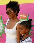 Actress Angela Bassett and daughter Bronwyn Vance arrive at the 2013 Kids Choice Awards in Los Angeles, California