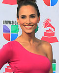 Television personality Danielle Demski poses as she arrives at the 13th Latin Grammy Awards in Las Vegas