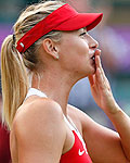 Russia's Sharapova celebrates after defeating Germany's Lisicki in their women's singles tennis match