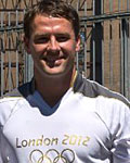 Michael Owen walks a dog pal and the Flame at Battersea Dogs and Cats Home