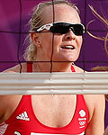 Britain's Shauna Mullin and Zara Dampney watch as Canada's Annie Martin misses the ball during their women's beach volleyball match at the London 2012 Olympics Games