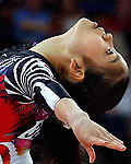 Yu Minobe of Japan competes in the floor exercise during the women's gymnastics qualification in London