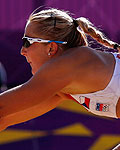 Hana Klapalova of the Czech Republic saves the ball during their women's preliminary round beach volleyball match against Mauritius at the London 2012 Olympic Games at Horse Guards Parade