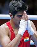 India's Vijender reacts after defeating Kazakhstan's Suzhanov in the Men's Middle (75kg) Round of 32 boxing match during the London 2012 Olympic Games