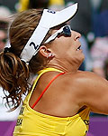 Brazil's Larissa digs the ball in their women's preliminary round beach volleyball match against Germany at the London 2012 Olympic Games at Horse Guards Parade