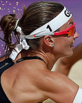 Germany's Katrin Holtwick tries to save the ball near her team mate Ilka Semmler during their women's preliminary round beach volleyball match at the London 2012 Olympic Games at Horse Guards Parade