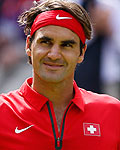 Switzerland's Roger Federer celebrates after defeating France's Benneteau in their men's singles tennis match at the All England Lawn Tennis Club during the London 2012 Olympics Games