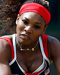 Serena Williams of the U.S. returns to Poland's Radwanska in their women's singles tennis match at the All England Lawn Tennis Club during the London 2012 Olympics Games