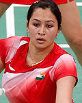 India's Jwala Gutta and Ashwini Ponnappa play against Singapore during their women's doubles badminton match during the London 2012 Olympic Games at the Wembley Arena