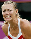 Maria Sharapova celebrates winning the first set in her women's singles tennis match against Britain's Robson at the All England Lawn Tennis Club during the London 2012 Olympic Games