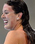 Allison Schmitt of the U.S. gestures after setting an Olympic record to win the women's 200m freestyle final during the London 2012 Olympic Games