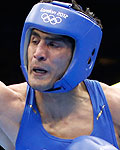 Gausha of the U.S. fights against India's Vijender in their Men's Middle (75kg) Round of 16 boxing match